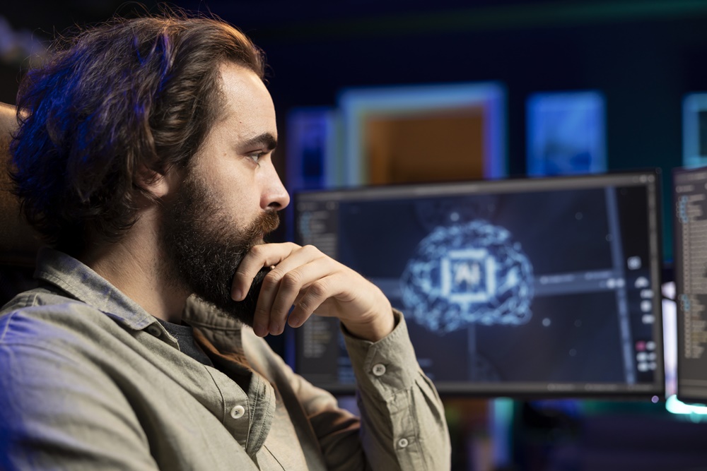 Software developer using computer for artificial intelligence computing simulating human brain through self learning algorithms. Man working with AI deep neural networks on desktop PC, close up shot