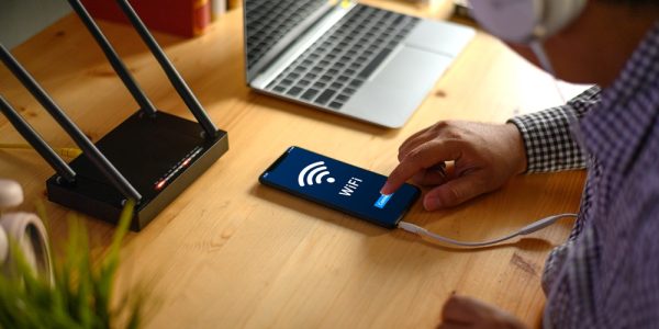 Young man Connecting router wifi On smartphone  for Internet and social media